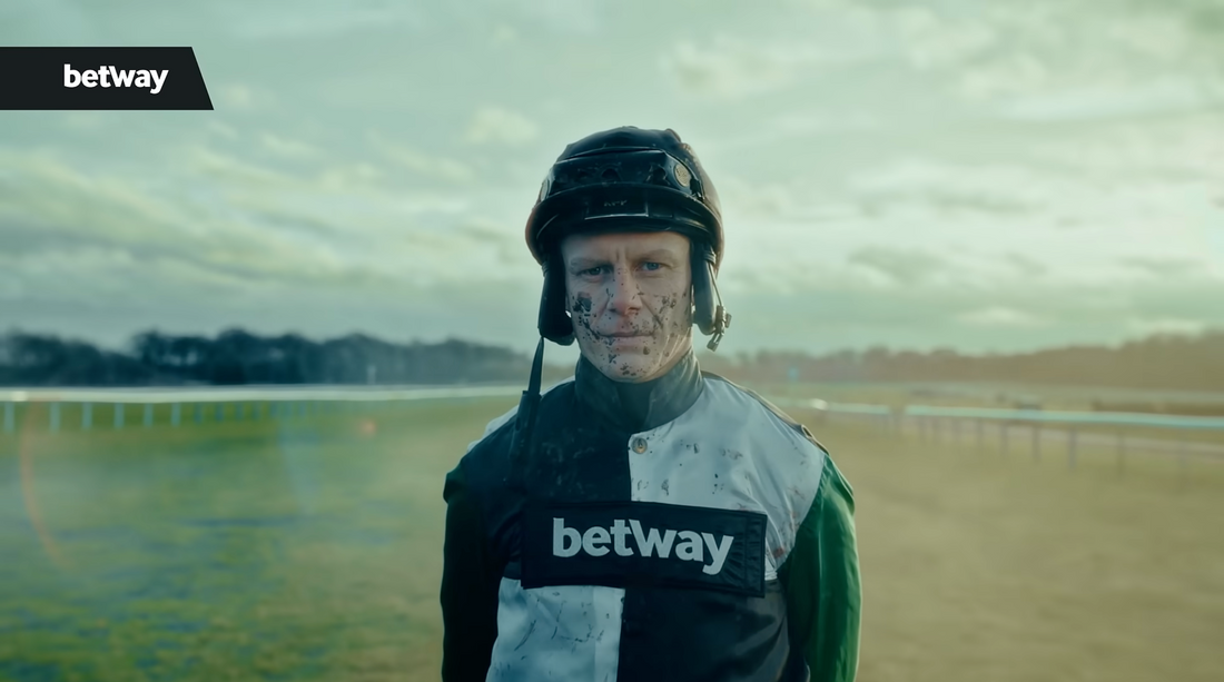 Custom embroidery and print for TV adversing. Featuring a jocky with our embriodery standing on a racecouse. 